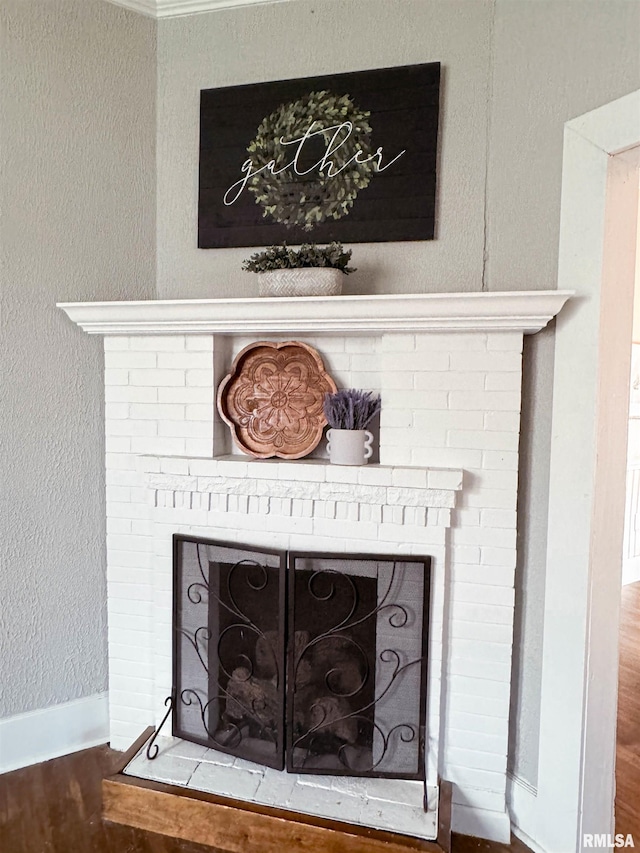 interior details with a fireplace and hardwood / wood-style flooring