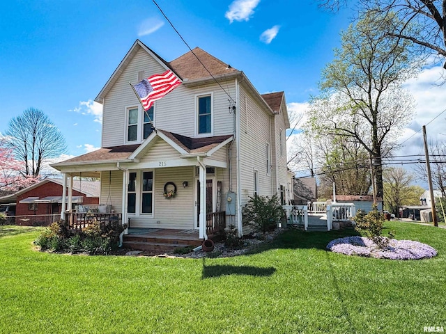 view of front of property with a front lawn and covered porch