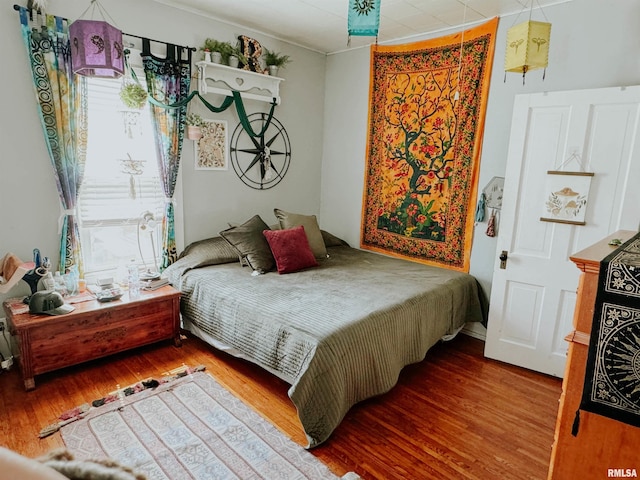 bedroom featuring hardwood / wood-style flooring