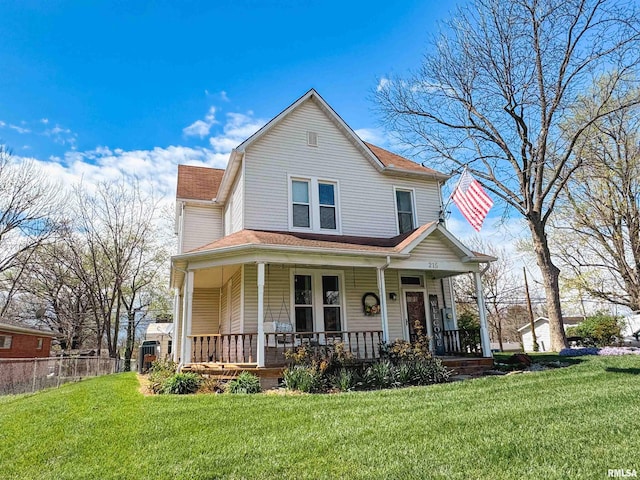 view of front facade with a porch and a front lawn