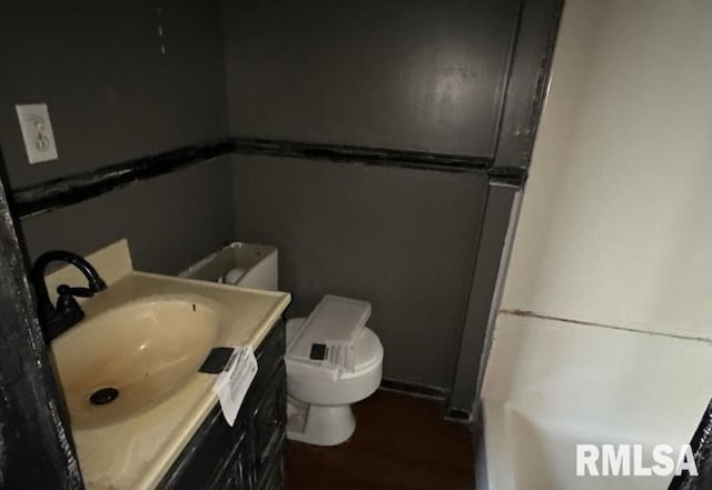 bathroom with vanity and toilet