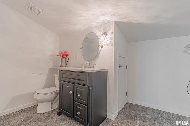 bathroom with toilet and large vanity