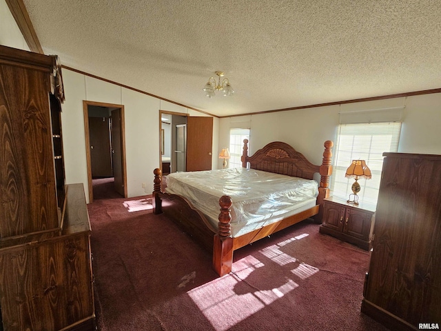 bedroom featuring a textured ceiling, dark colored carpet, and multiple windows