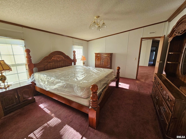 bedroom featuring multiple windows, a textured ceiling, an inviting chandelier, and carpet flooring