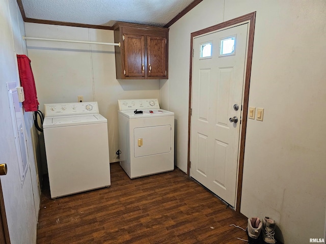 laundry room featuring cabinets, dark hardwood / wood-style flooring, separate washer and dryer, and a textured ceiling