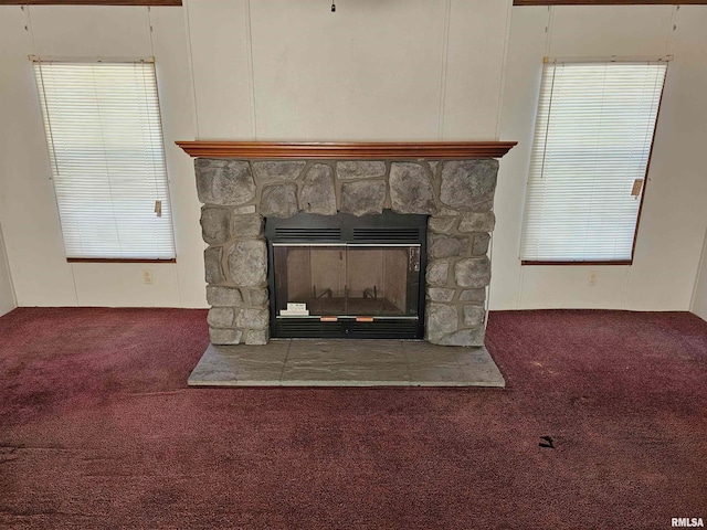 details featuring carpet flooring and a stone fireplace