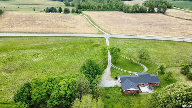 birds eye view of property with a rural view