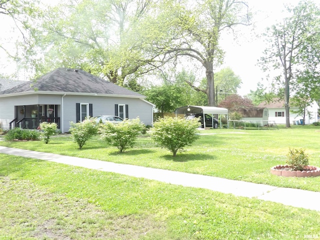 view of yard featuring a carport