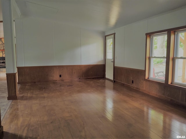 spare room with dark wood-type flooring