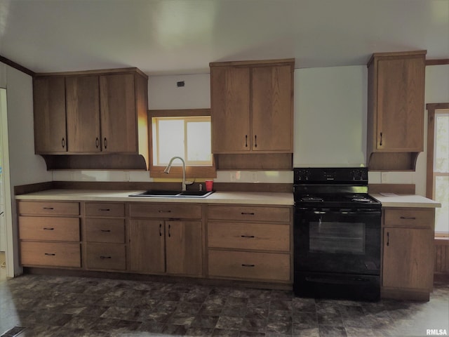 kitchen with a wealth of natural light, black electric range, and sink