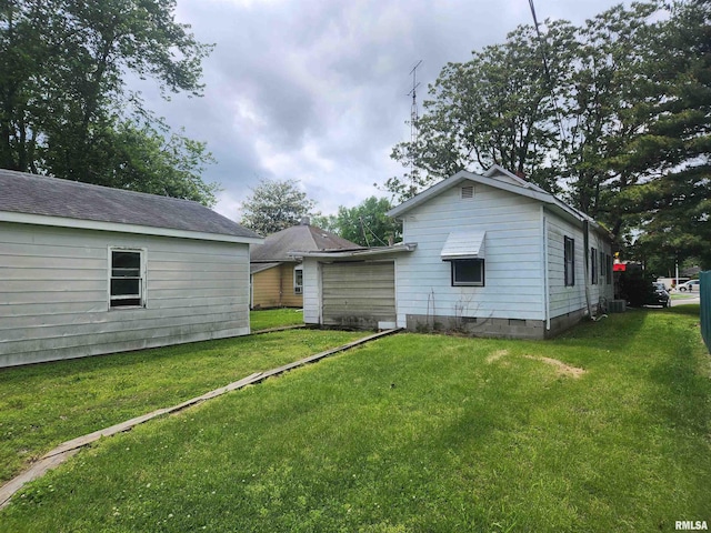 back of property featuring a lawn