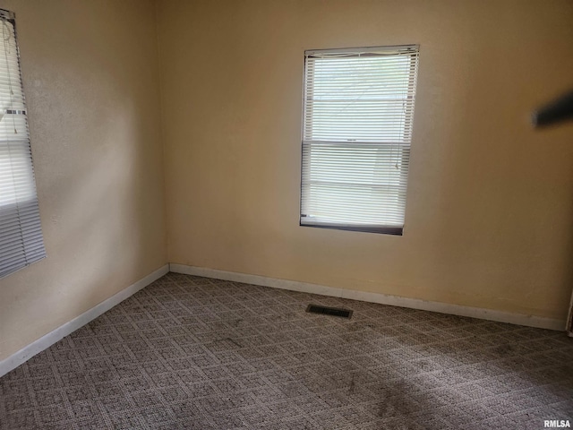 spare room with carpet floors