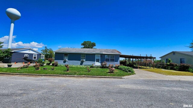 99 Iroquois St, Mcclure, IL 62957 - ranch-style house featuring driveway and a carport