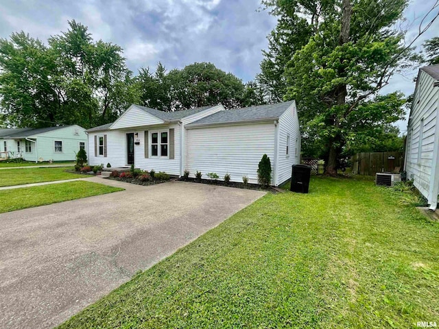 single story home featuring a front yard and central air condition unit