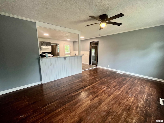 interior space featuring crown molding, ceiling fan, a textured ceiling, and wood-type flooring