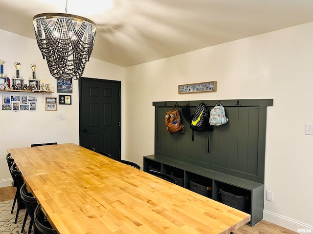 dining area with a chandelier and hardwood / wood-style flooring