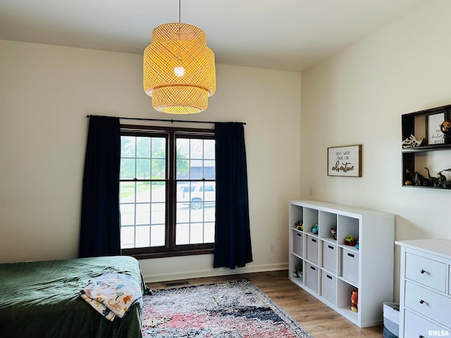 bedroom featuring wood-type flooring