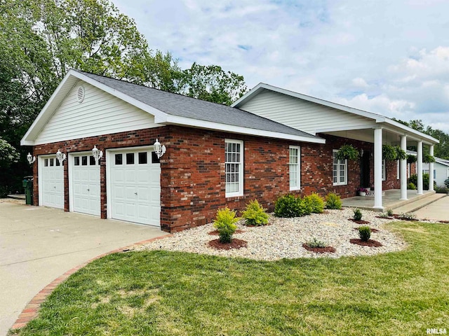 ranch-style home with a garage, a front lawn, and a porch