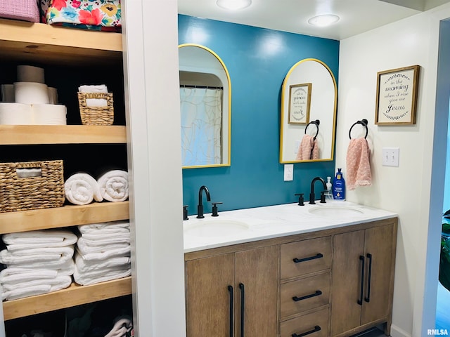 bathroom featuring dual bowl vanity