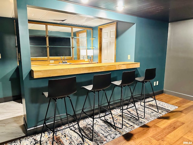 bar featuring hardwood / wood-style floors