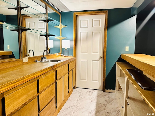 bathroom featuring tile floors and vanity