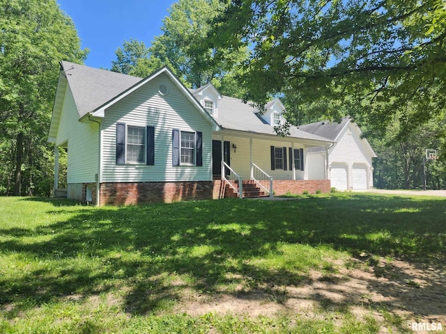 view of front of property featuring a garage and a front lawn