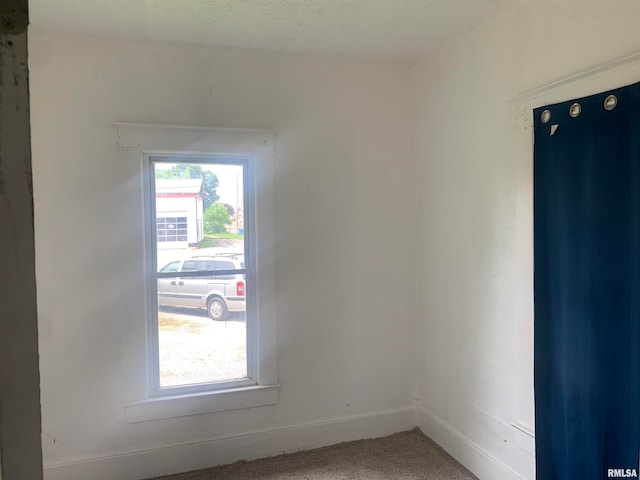 spare room featuring carpet floors