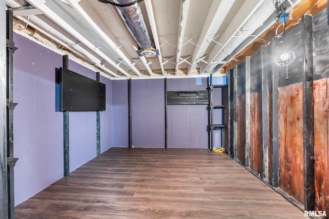 basement featuring hardwood / wood-style flooring