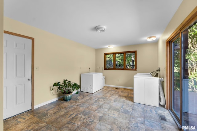 laundry room with tile floors and washer / clothes dryer