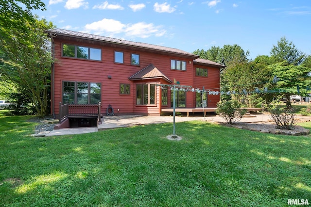 back of house with a yard and a deck