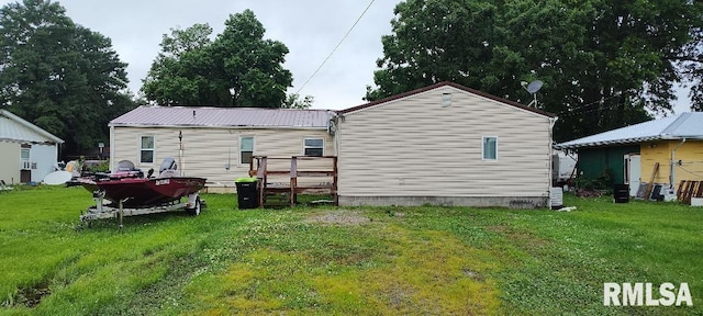 108 N Spencer St, Mounds, IL 62964 - rear view of house featuring crawl space and a lawn