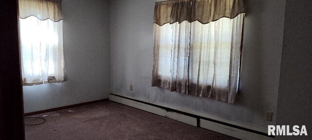 108 N Spencer St, Mounds, IL 62964 - unfurnished room featuring a baseboard radiator and carpet floors