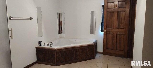 108 N Spencer St, Mounds, IL 62964 - bathroom with a garden tub, tile patterned floors, and baseboards