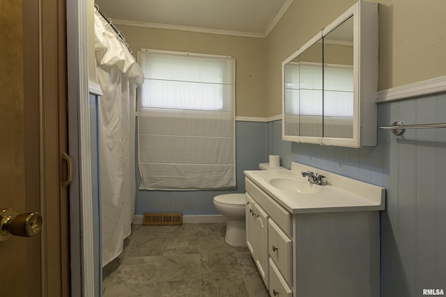 bathroom with vanity, ornamental molding, and toilet