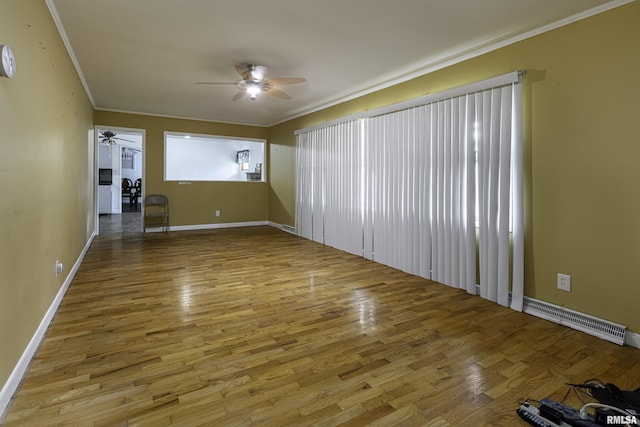 unfurnished living room with hardwood / wood-style flooring, ceiling fan, and ornamental molding