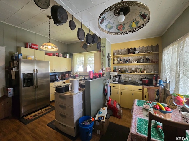 kitchen featuring decorative backsplash, stainless steel fridge with ice dispenser, and dark hardwood / wood-style flooring