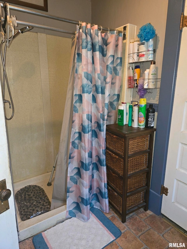 bathroom with a shower with shower curtain