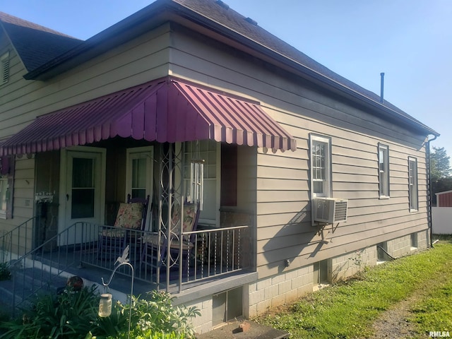 view of side of home with cooling unit