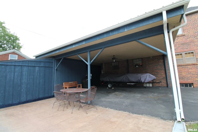 view of vehicle parking featuring an attached carport