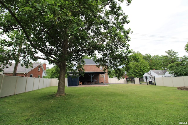 view of yard with a fenced backyard and a patio