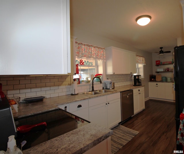 kitchen featuring decorative backsplash, stainless steel dishwasher, dark wood-type flooring, white cabinetry, and a sink