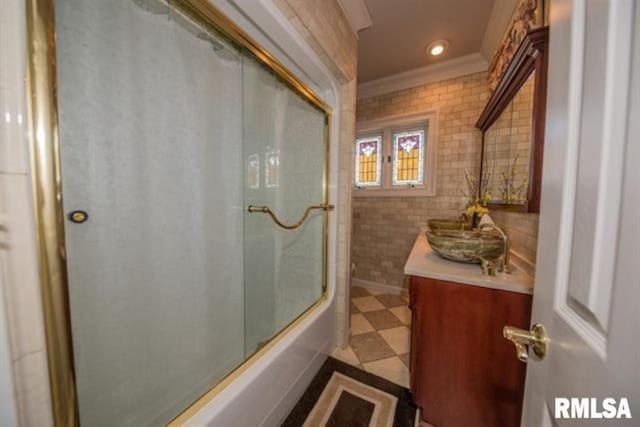 521 S Park Ave, Herrin, IL 62948 - full bathroom with vanity, ornamental molding, combined bath / shower with glass door, tile walls, and recessed lighting
