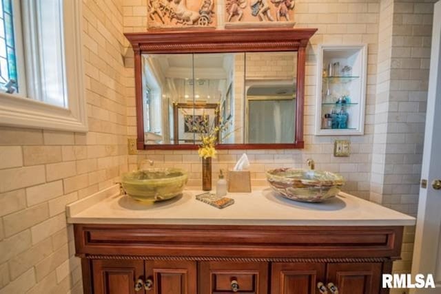 521 S Park Ave, Herrin, IL 62948 - full bathroom with double vanity, backsplash, and tile walls