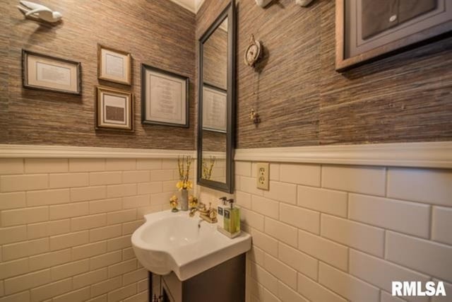 521 S Park Ave, Herrin, IL 62948 - bathroom with vanity, a wainscoted wall, and tile walls