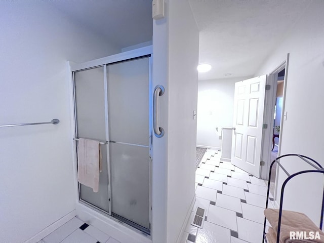 bathroom featuring walk in shower