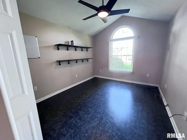 unfurnished room with vaulted ceiling and ceiling fan