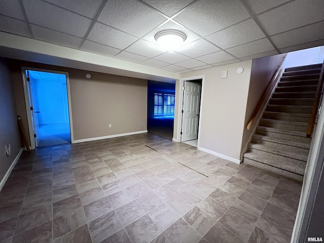 basement featuring a drop ceiling