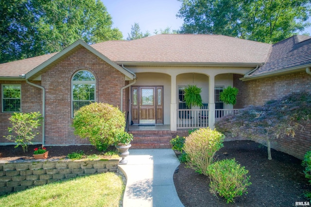 property entrance featuring covered porch