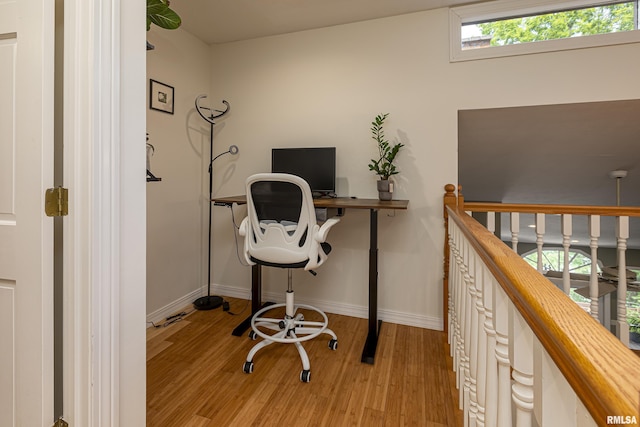 office area with light hardwood / wood-style floors