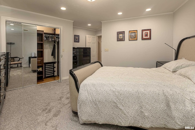 bedroom featuring carpet, ornamental molding, and a closet